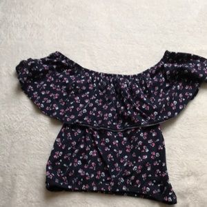Navy blue croptop with pink and white flowers.